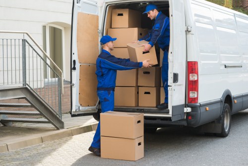 Commercial moving team transporting office equipment in Silvertown