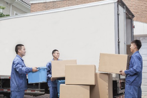 Furniture being carried into a Silvertown flat with careful access planning