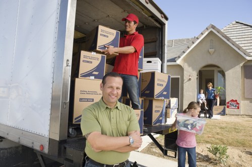 Business relocation preparation with labelled boxes and office equipment