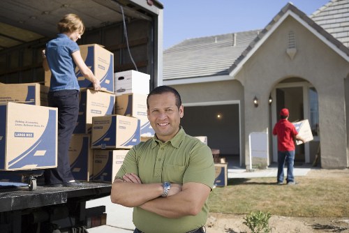 Careful wrapping of fragile household items for moving