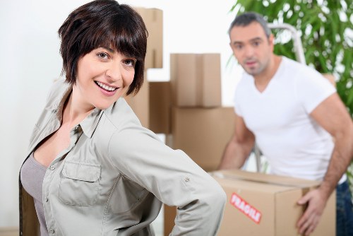 Packed moving boxes and furniture for a local home relocation