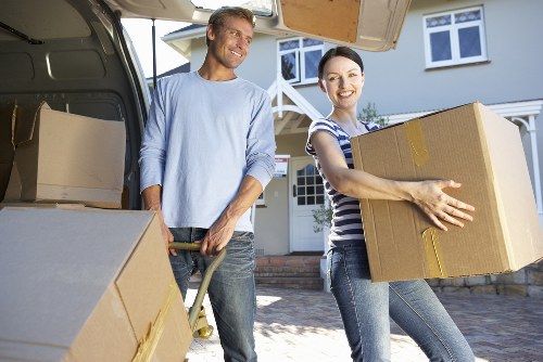 Professional movers handling apartment access during a Silvertown relocation